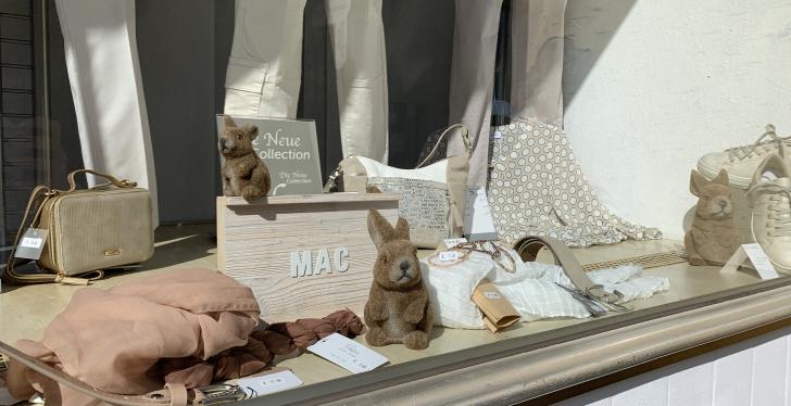 A shop window decorated with bunnies to match Easter....