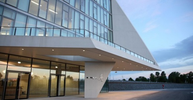 The glazed atrium: the ingress of intensive daylight reaches the balustrades...