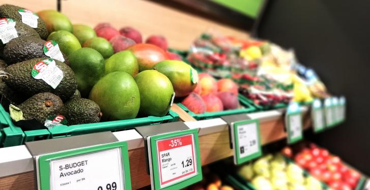 Fruit shelves with price tags in the supermarket