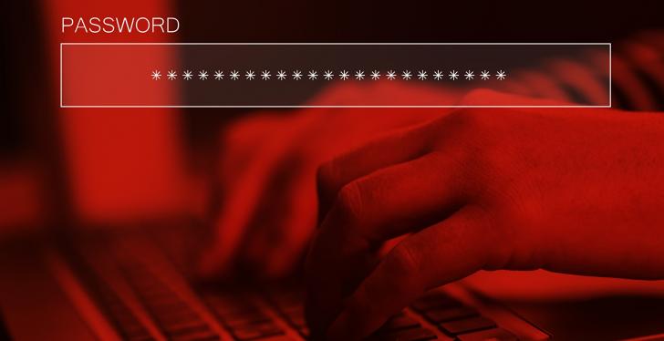 Fingers typing on a keyboard, picture colored in dark red; copyright:...