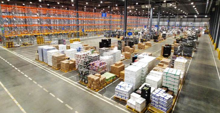 Huge warehouse with pallets and crates; copyright: Walmart...