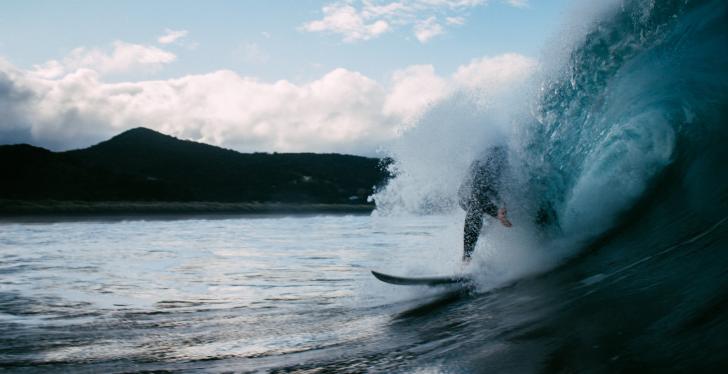 Surfer on a wave in the sea