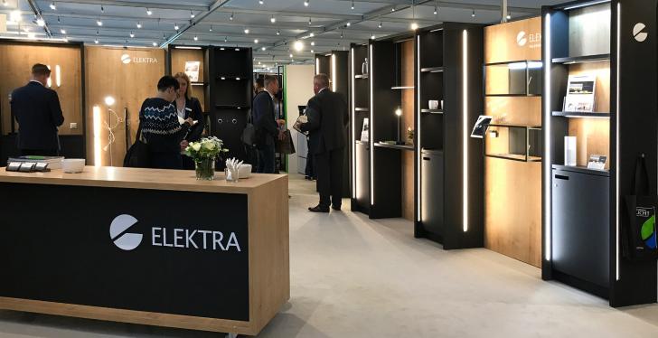 Elektra stand with wooden shelves, indirect lighting and visitors...