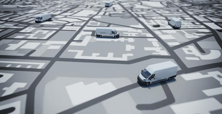 Trucks on a paper map in grey color; copyright: PantherMedia/alphaspirit...