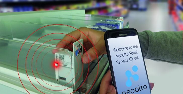 A person holds a smartphone on which the neoalto Retail Service Cloud can be...