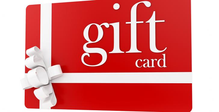 A red and white gift card with a ribbon