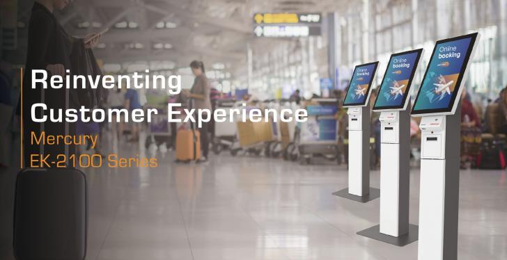 An airport terminal hall with passengers and self-service kiosks...