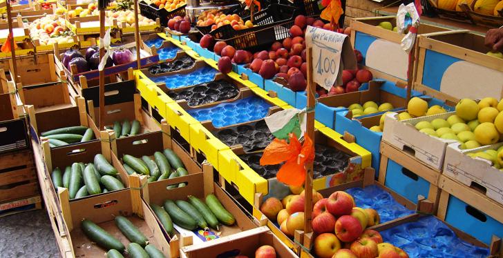 Market stand outside with fresh fruits and vegetables...