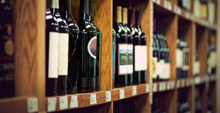 A wine rack with wine bottles