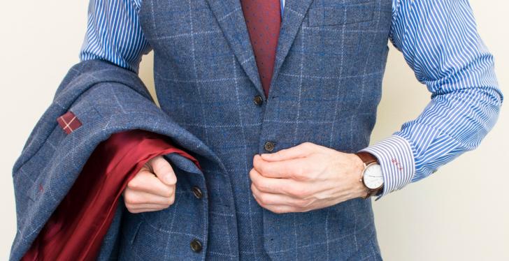 A man wearing a tailored suit with a waistcoat