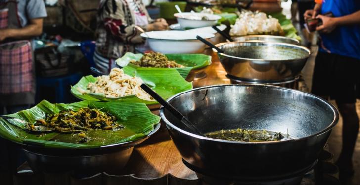 South Asian market with fresh prepared meals on a table...