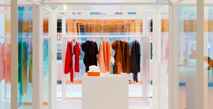 Colorful clothes hanging on a clothes rail