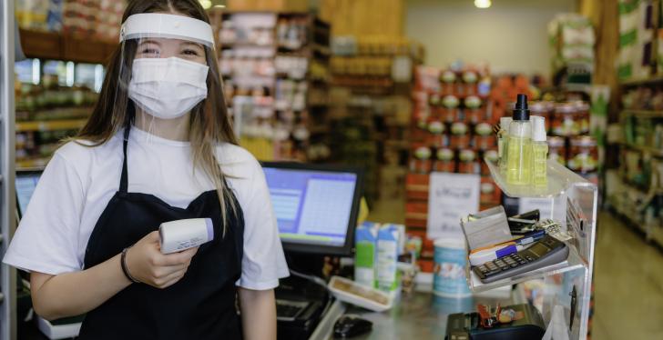 A young employee works in a retail company