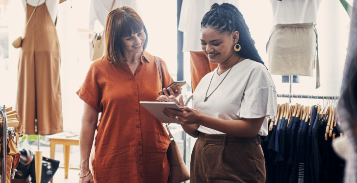 Two women looking at a tablet