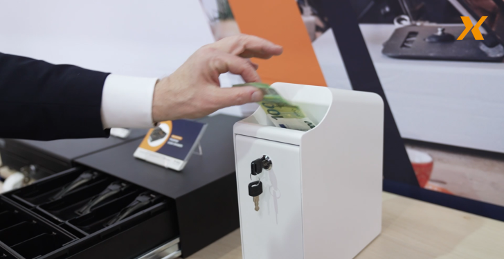 Image: A hand of a man in suite takes a banknote out of a counting machine -...