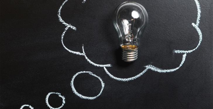 A light bulb inside a thought bubble