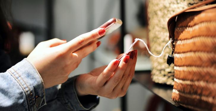 A person scans a product label with a smartphone