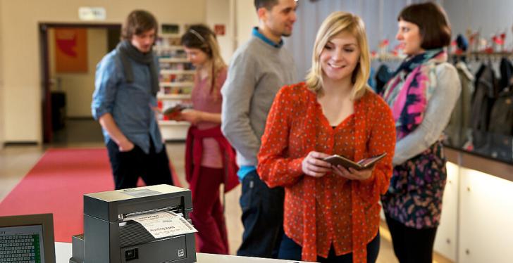 Woman at mobile ticketing printer