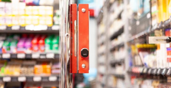 A red security cylinder on a door