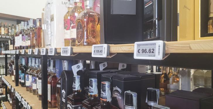 A wine rack with electronic shelf labels