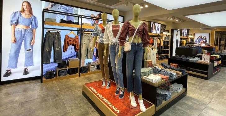 Inside view of a Levis store with different clothes...