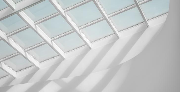 Bright sunlight shines through a white skylight