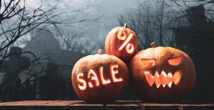 Carved Halloween pumpkins with sales inscription