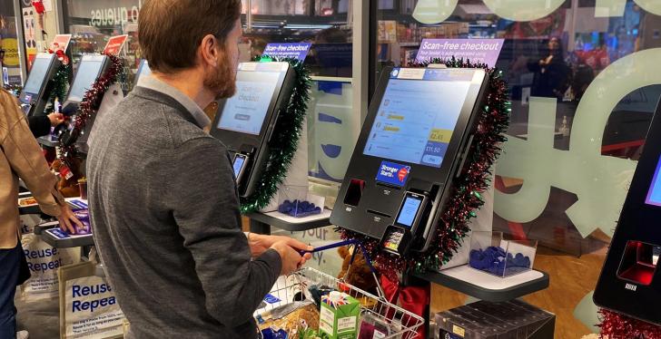 A man is using a self-service station