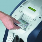 Photo: Cash: Automation reduces costs and is safer