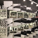 A shelf with products composed of square offset blocks painted in black and...