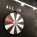 A black and white rotary wheel with a red field