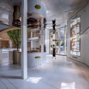 A modern style pastry store with curved arches and large windows...