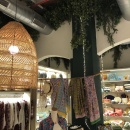 View into the back part of the shop with large ceiling light in the foreground...