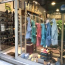 A shop window with clothes hanging on a rope