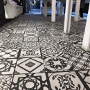 A black and white patterned tile floor