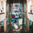 A huge art installation with colored paper in the foyer of a shopping mall;...