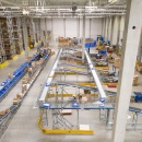 A view of a large warehouse with parcels and letters on conveyor belts...