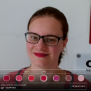 A woman testing virtual make-up try on in a webshop...