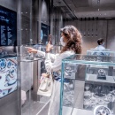 A customer uses the screen to view products using gesture control...