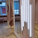 Mirrors on pink walls.
