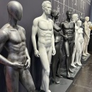 7 metallic mannequins in gray and white with athletic poses....