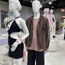 2 mannequins wearing fashion.