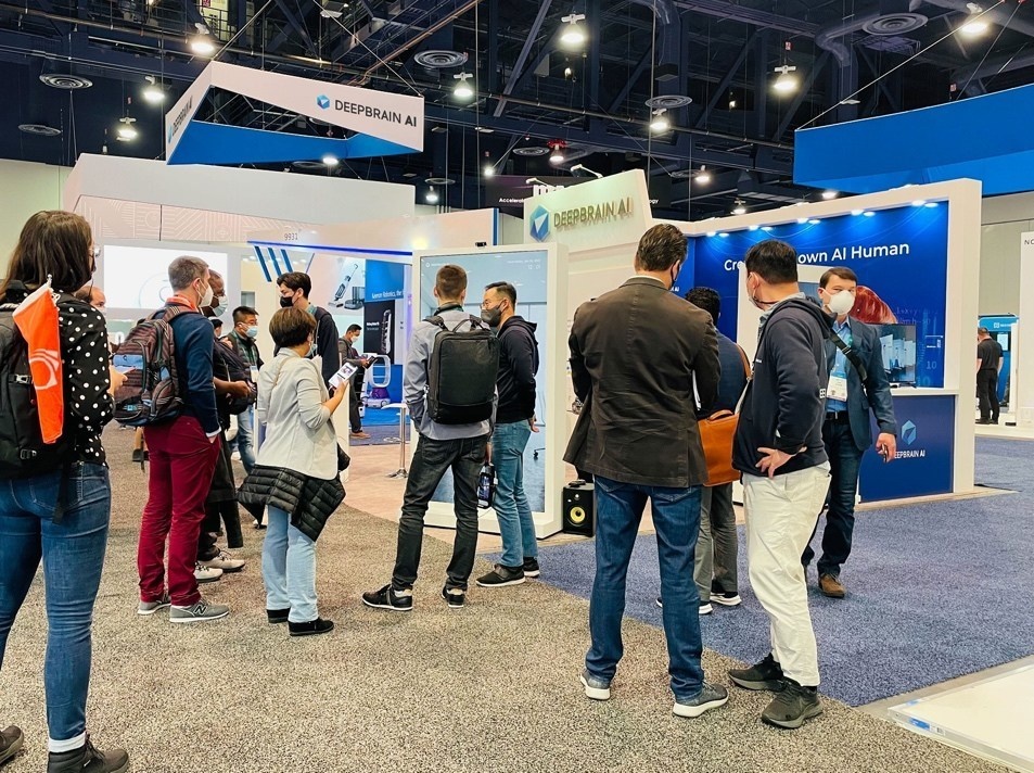 trade fair visitors at a booth at CES 2022