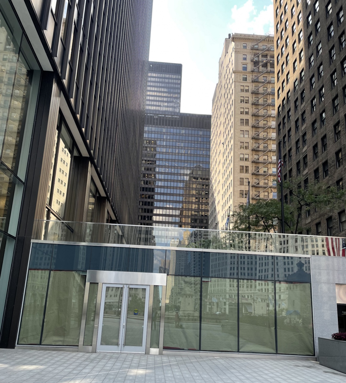 The storefront of a closed Amazon Go store in Chicago in a canyon of houses...