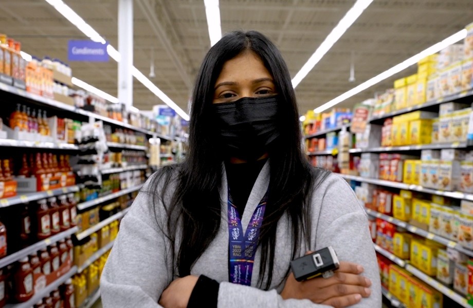 A person with a ring scanner looking at the camera