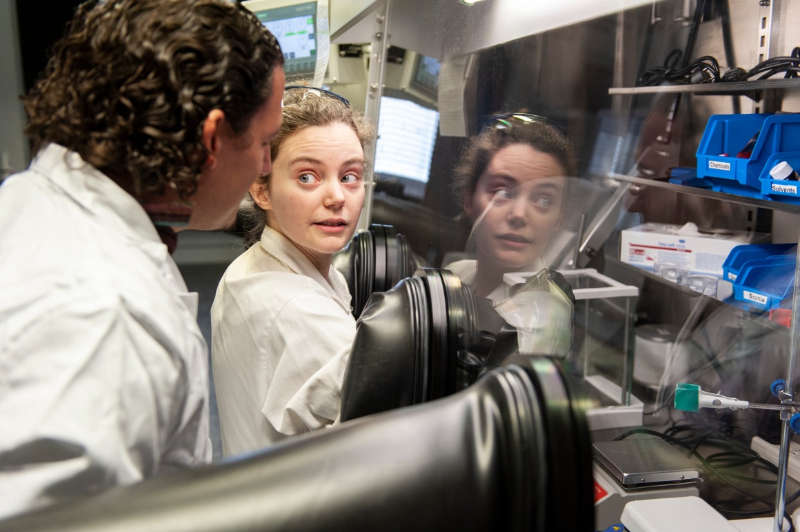 Prof. Rubén D. Costa and his student Ginnevra Giobbio work on the glove-box at...