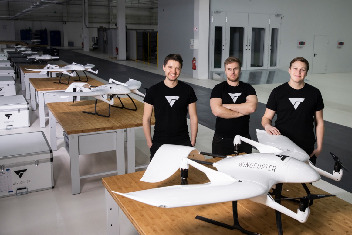 The three founders of the company Wingcopter are standing in their production...