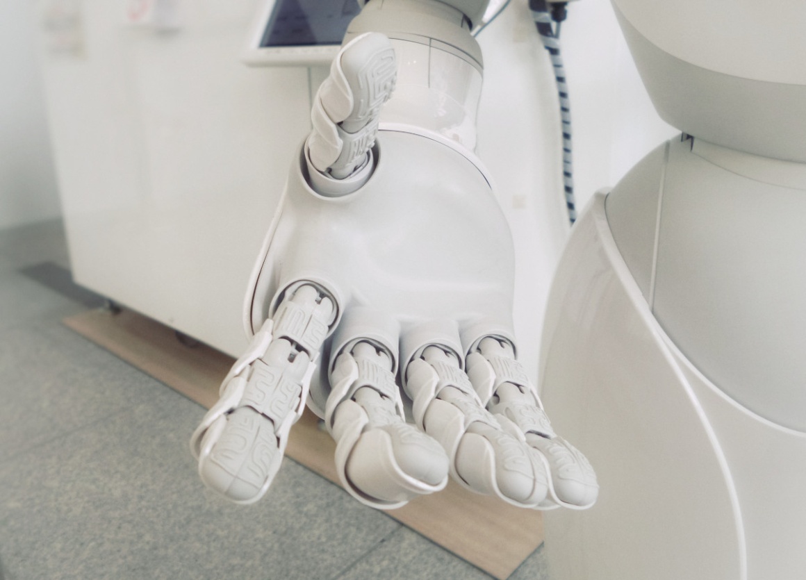 A white hand of a sophisticated robot; copyright: Possessed Photography/Unsplash...