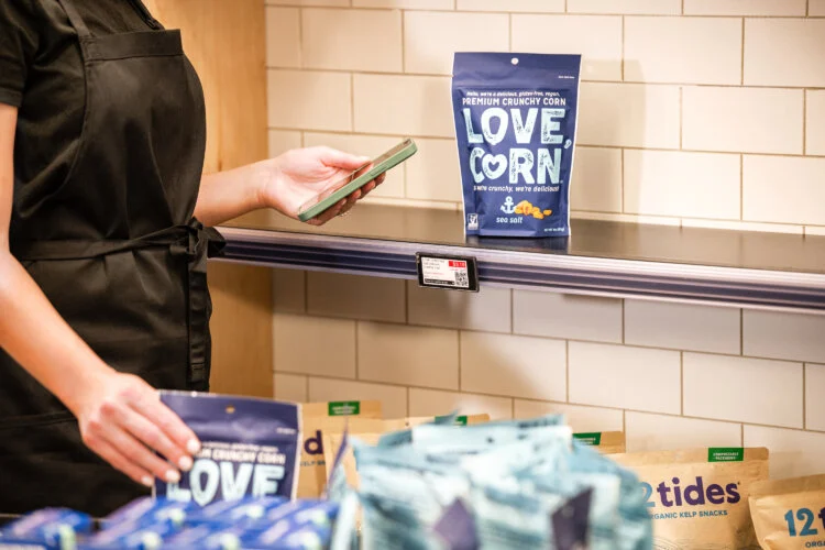 A person placing products on a shelf