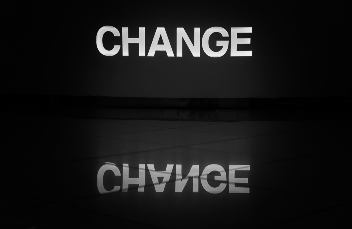 The word Change written in bright white letters on black background...
